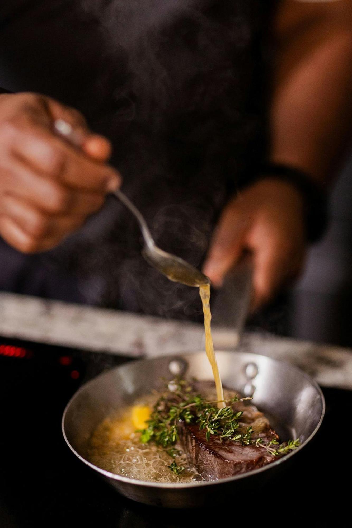 Stock Exchange Hotel Manchester Exteriör bild A chef seasoning a dish
